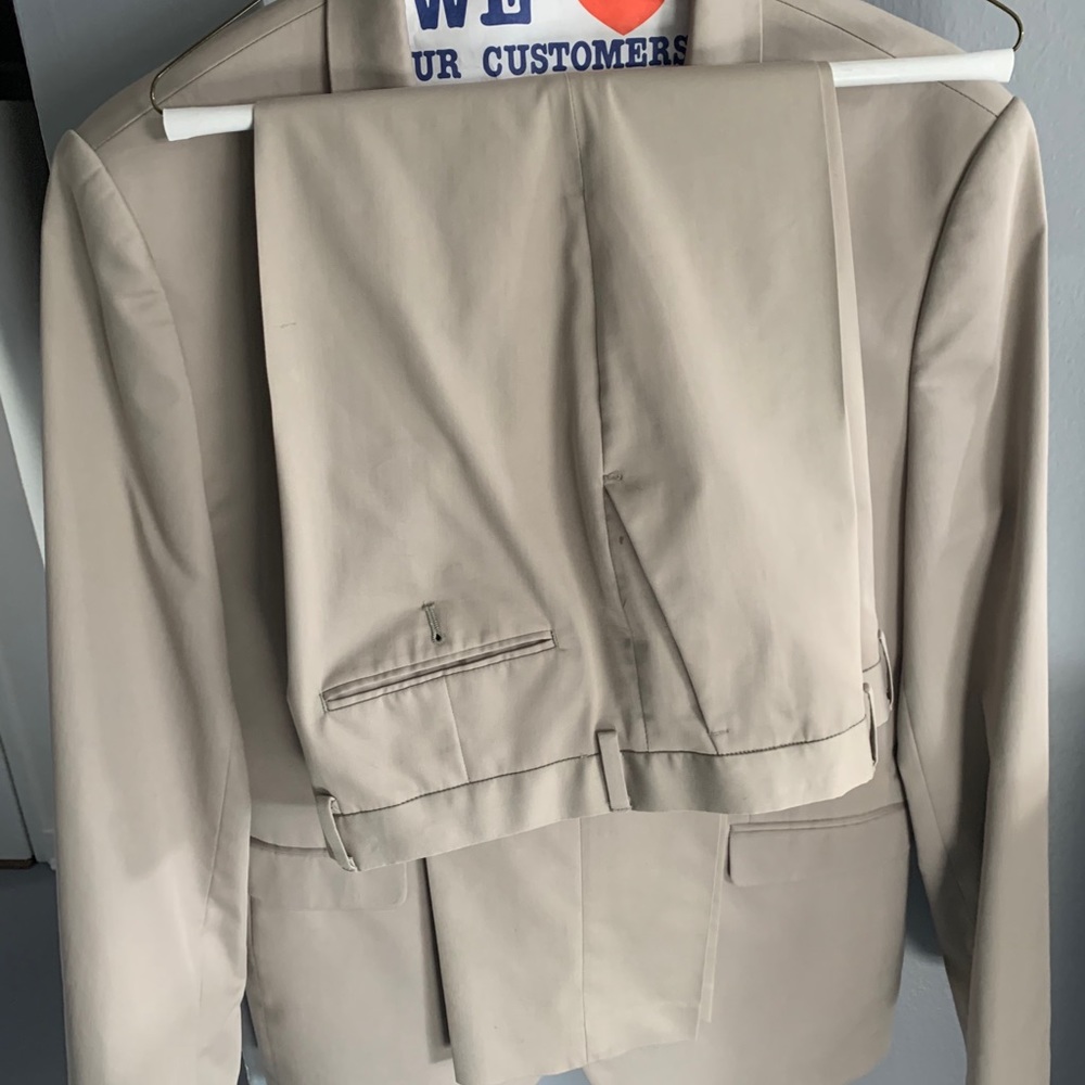 Men’s tan suit jacket and pant.Extra slim